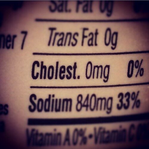 Doctor reviewing cholesterol and lipid panel results with a patient